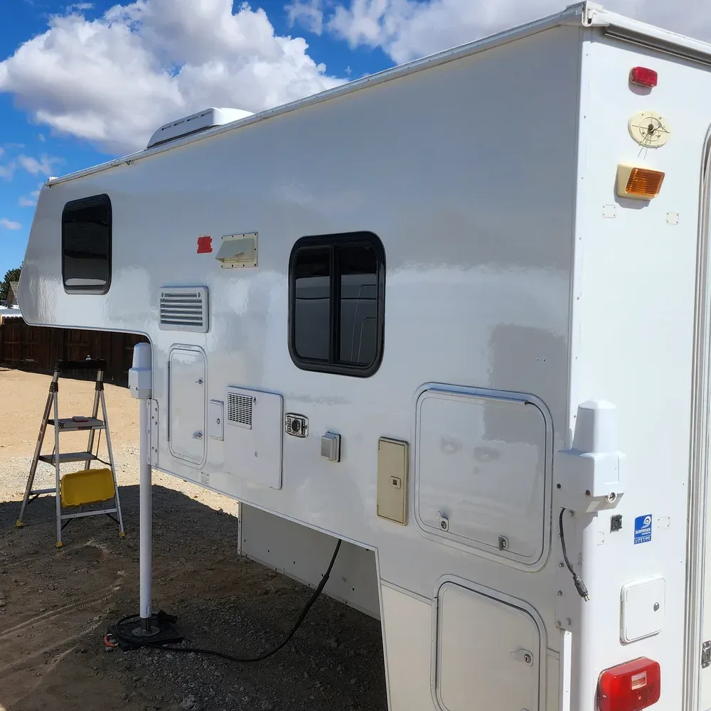 White Lance truck camper after oxidation removal and ceramic coating on the fiberglass in Reno, NV